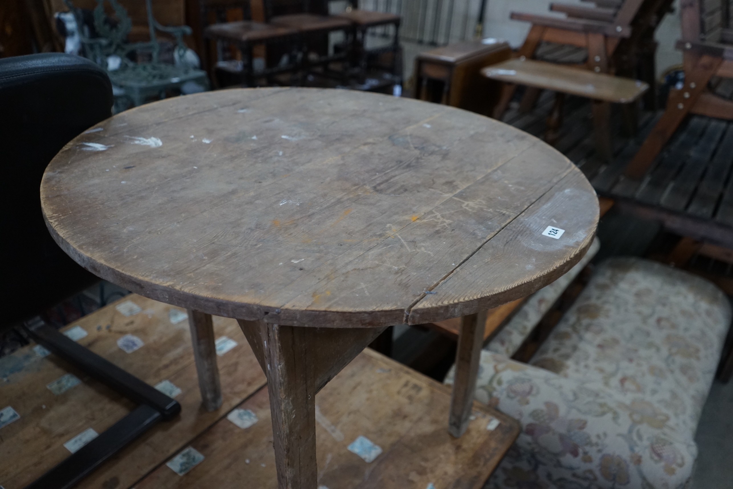 A 19th century circular pine cricket table, diameter 84cm, height 75cm